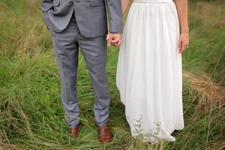 Bride and Groom holding hands