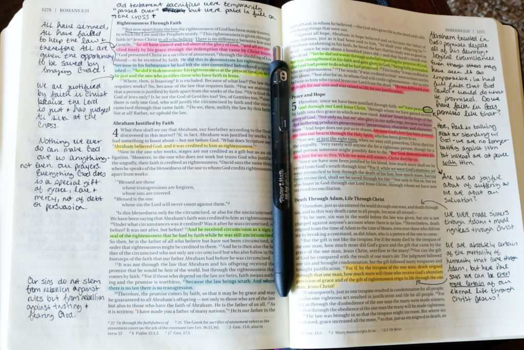 Journaling bible with notes in the margins