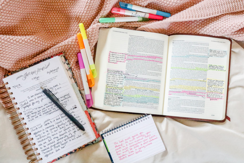 Bible study flat lay with journaling BIble, memory verse journal and Bible highlighters.