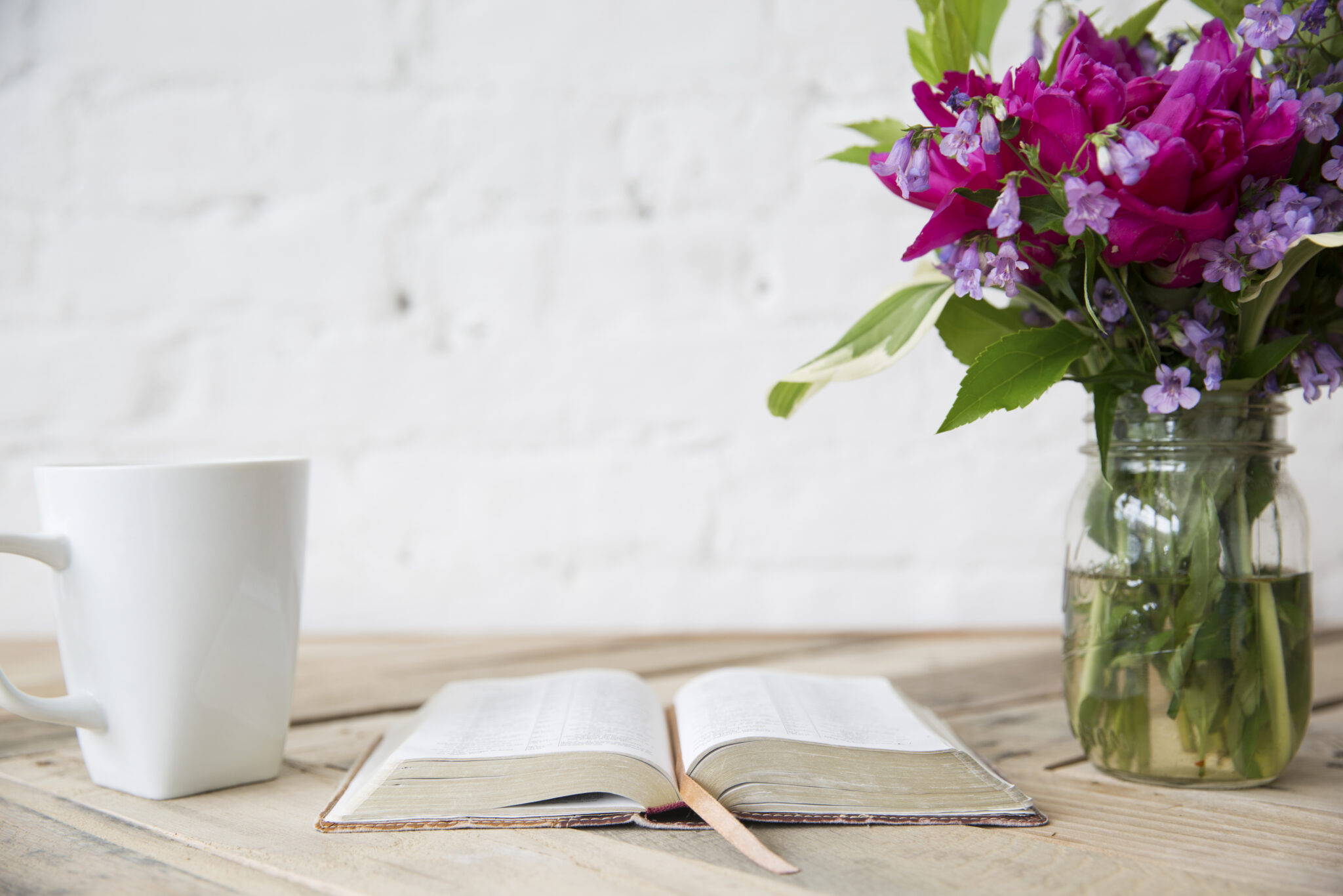 Inductive Bible study how to guide, Bible and flowers and coffee on a table