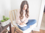 woman writing scripture using Scripture writing plan